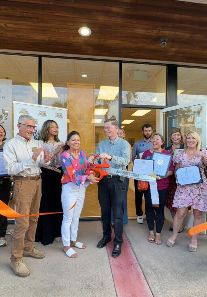 French Florist ribbon cutting in orange