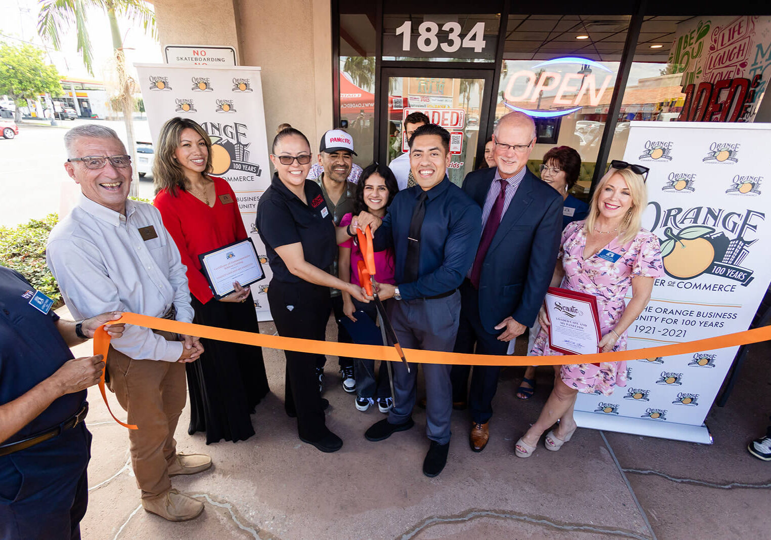 Loaded Cafe and My Panecito ribbon cutting in orange